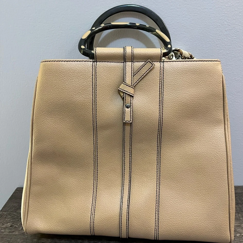 Tan leather tote with acrylic handles by Christine deGennaro